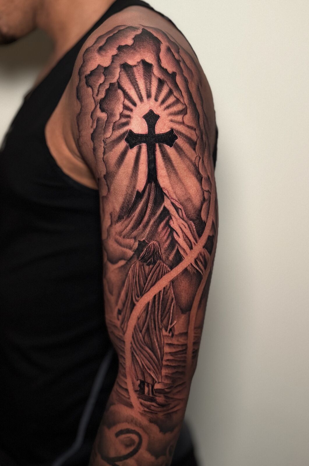 Cross and praying hands half sleeve with clouds