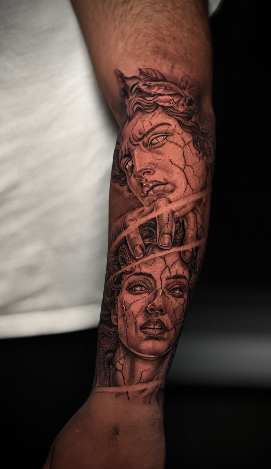 Two portraits forming a forearm sleeve