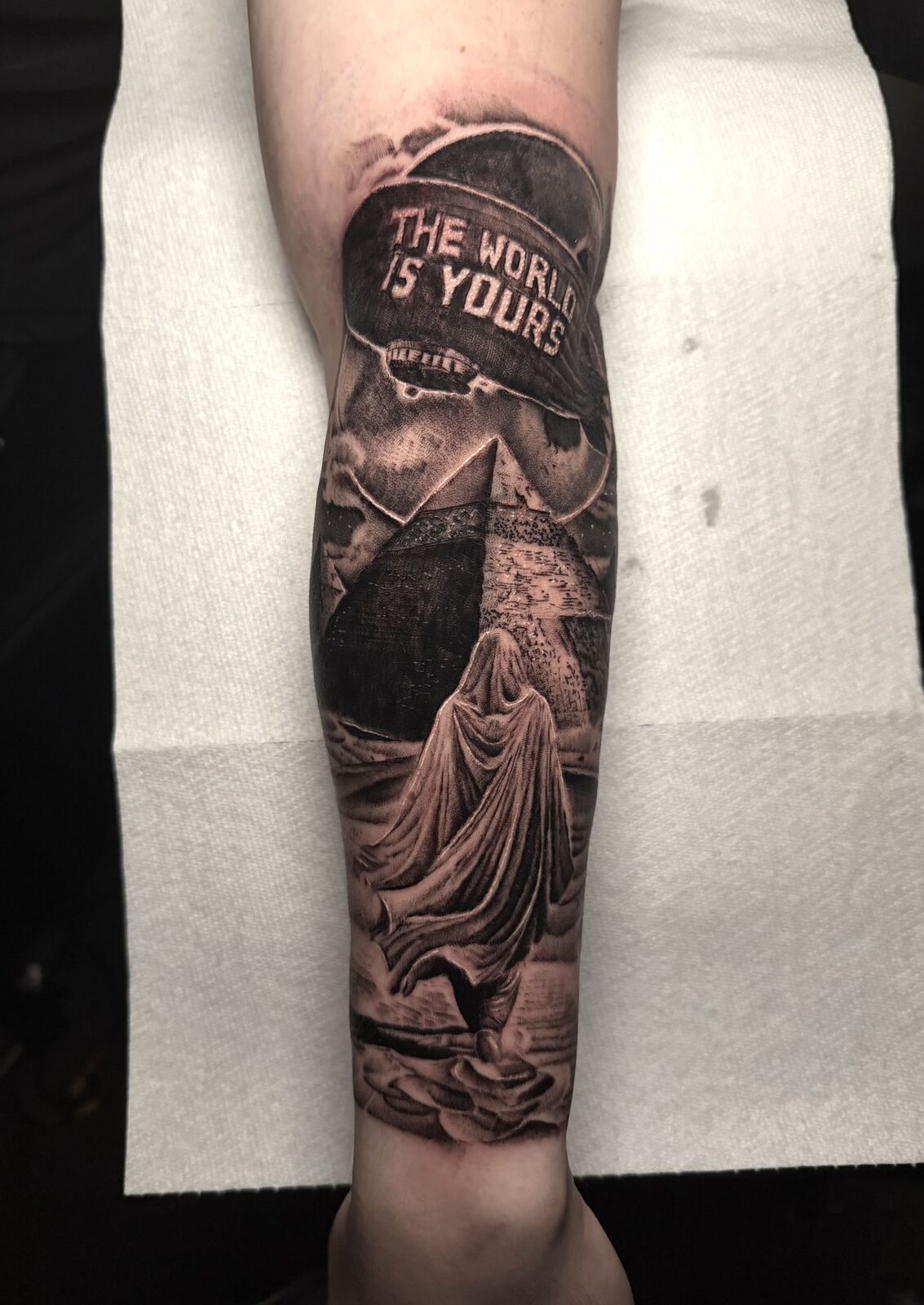 The World Is Yours blimp and pyramids forearm piece